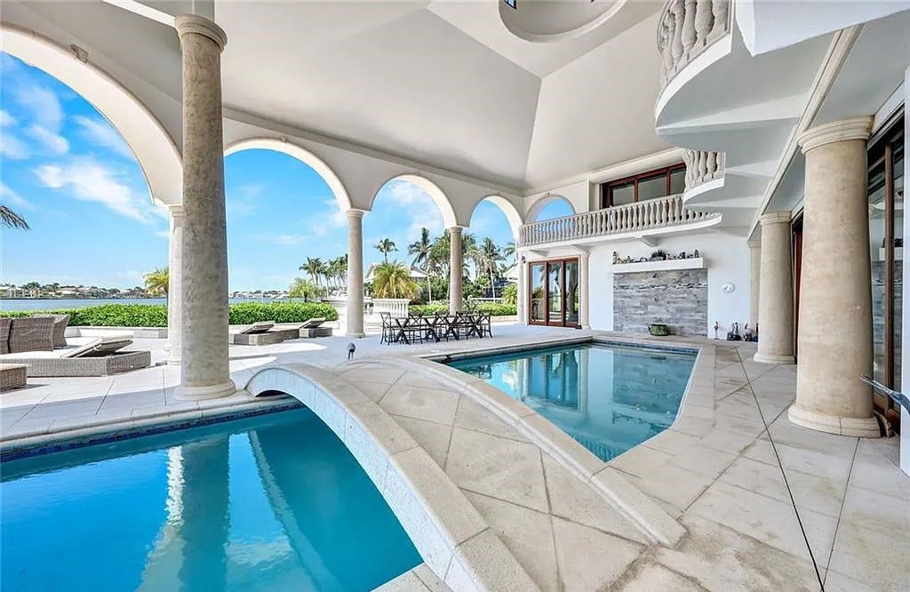 Nestled on a rare .78-acre tip-lot with 356 feet of seawall, Villa Italia at 550 Alameda Court, Marco Island, Florida, is a waterfront masterpiece. This opulent estate, built in 1977, spans 9,874 square feet and offers six ensuite bedrooms, a separate guest house, and a host of luxurious amenities, including a wine cellar, home theater, and game room.