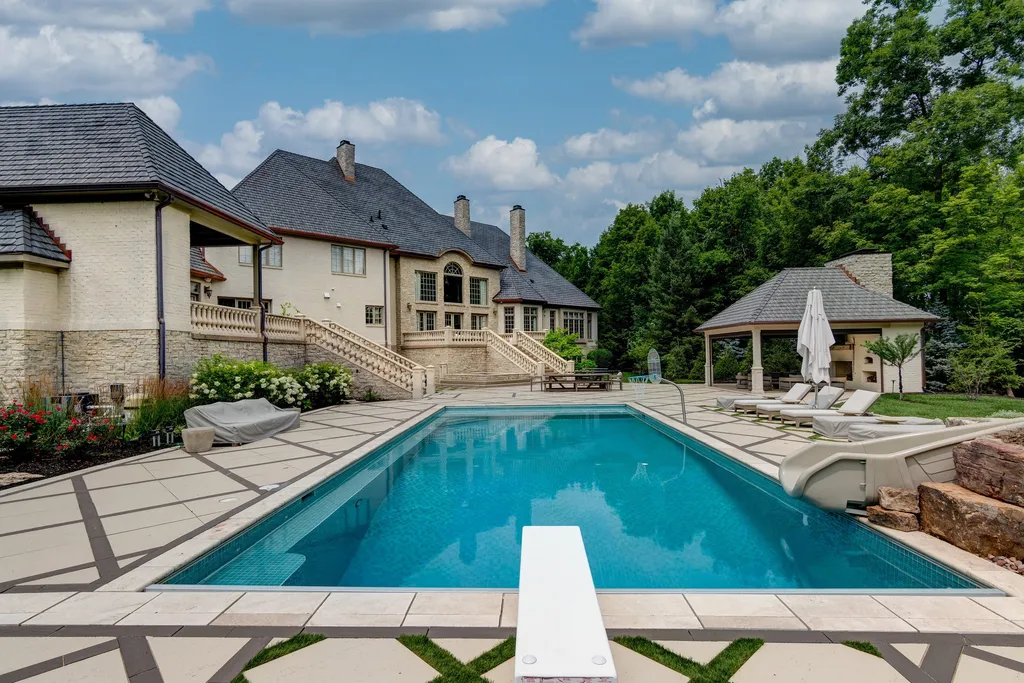 11101 Hawthorn Ridge Home in Fishers, Indiana. Explore the breathtaking elegance of 11101 Hawthorn Ridge, a custom-designed estate in Hamilton Proper. Nestled on over 6 acres of meticulously landscaped grounds, this gated residence offers unparalleled privacy and sophistication.
