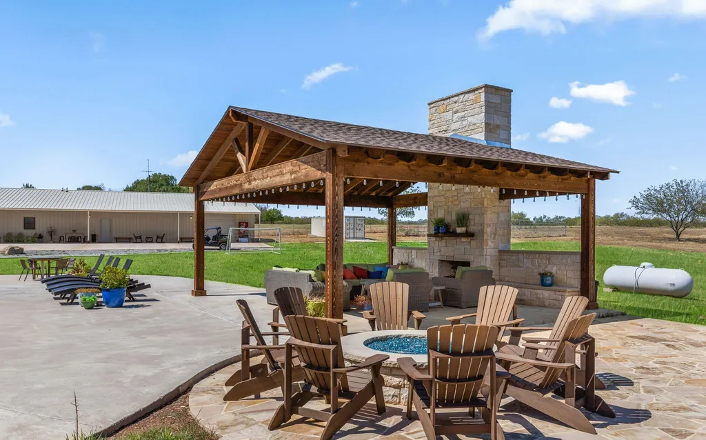 1134 Kinta Trial Home in Wichita Falls, Texas. Discover this unique 10-acre property in Clay County, featuring a stunning 6-bedroom home with 6.5 bathrooms, 6 fireplaces, a heated pool, outdoor kitchen, and even a catfish pond for fishing.