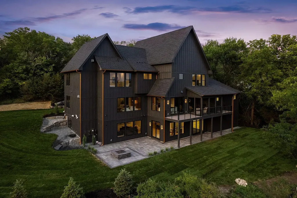 11411 Riverview Road Home in Eden Prairie, Minnesota. This luxury new construction home is the epitome of quality and craftsmanship. As you step into the open-concept main level, you'll be greeted by breathtaking views of the Minnesota River valley. The home boasts an array of high-end features and amenities that make it truly exceptional.