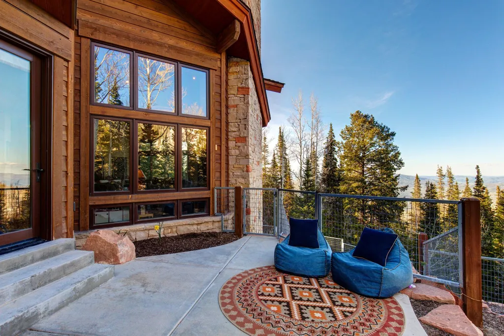147 White Pine Canyon Road Home in Park City, Utah. Perched atop The Colony, Park City's premier gated ski-in ski-out neighborhood, this quintessential mountain home offers unmatched privacy, ski access, and breathtaking views. Set on 4.6 secluded acres, this property provides a tranquil escape for friends and families to embrace the mountain lifestyle. 