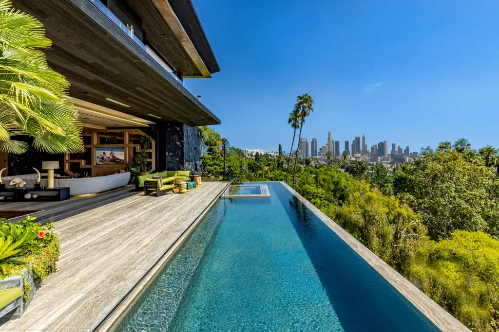 1851 North Stanley Avenue Home in Los Angeles, California. Step into the world of legends at the Californication House, a mid-century modern paradise perched above the Sunset Strip. This architectural gem boasts 270-degree views, unmatched privacy, and the finest craftsmanship. 