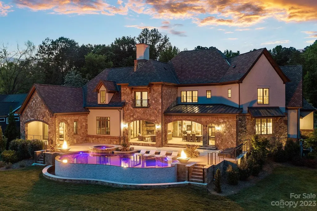 189 Riverwood Road Home in Mooresville, North Carolina. Discover the epitome of luxury in this private gated home nestled on over an acre of pristine land. This magnificent custom-built residence was meticulously completed in 2020, offering the ultimate in modern living and unparalleled lakefront vistas.