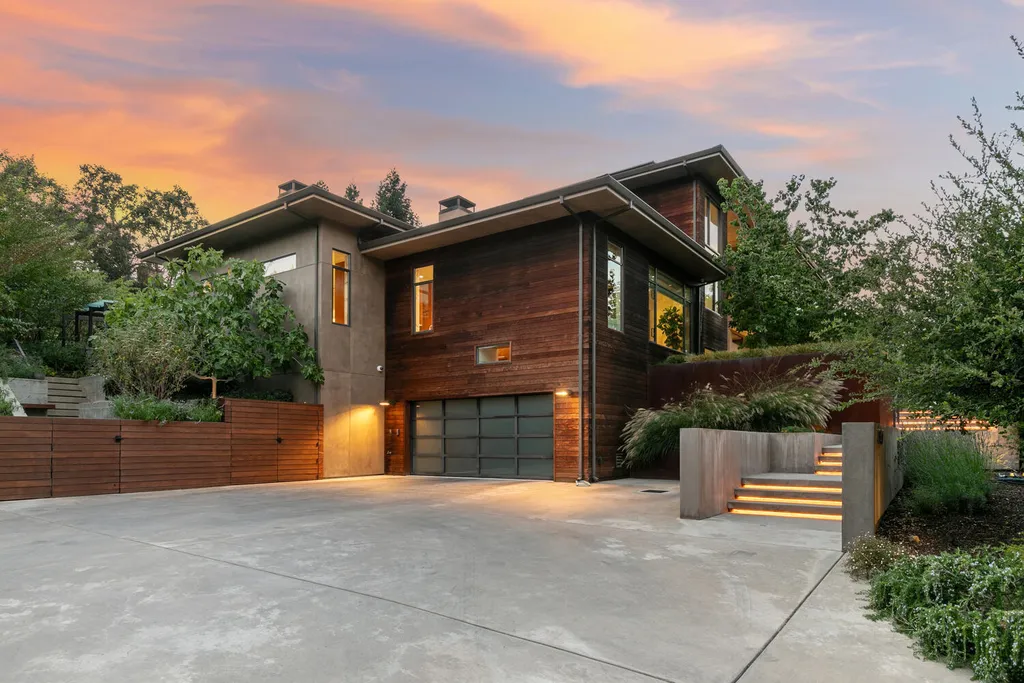 2140 Forest View Avenue Home in Hillsborough, California. Step into the future with this 2016-built contemporary masterpiece located on a premier street in lower North Hillsborough. Designed by architect Dan Phipps and constructed by Toboni Builders, this home is a model of sustainable living with features like solar power, radiant-heated concrete or oak floors, EV wiring, and a radiant deck-heated saltwater pool, all situated on just over half an acre.