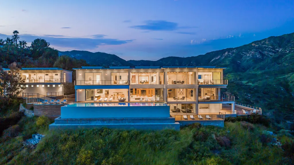 23800 Malibu Crest Drive Home in Malibu, California. Experience the pinnacle of coastal living in this new construction estate on a 3.4-acre promontory in Malibu. With breathtaking ocean, mountain, and canyon views, this 16,500-SF compound features a main house and guest house with luxurious amenities, including a Bulthaup chef's kitchen, infinity pool, and spa. 