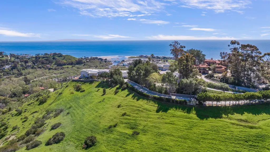 23800 Malibu Crest Drive Home in Malibu, California. Experience the pinnacle of coastal living in this new construction estate on a 3.4-acre promontory in Malibu. With breathtaking ocean, mountain, and canyon views, this 16,500-SF compound features a main house and guest house with luxurious amenities, including a Bulthaup chef's kitchen, infinity pool, and spa. 