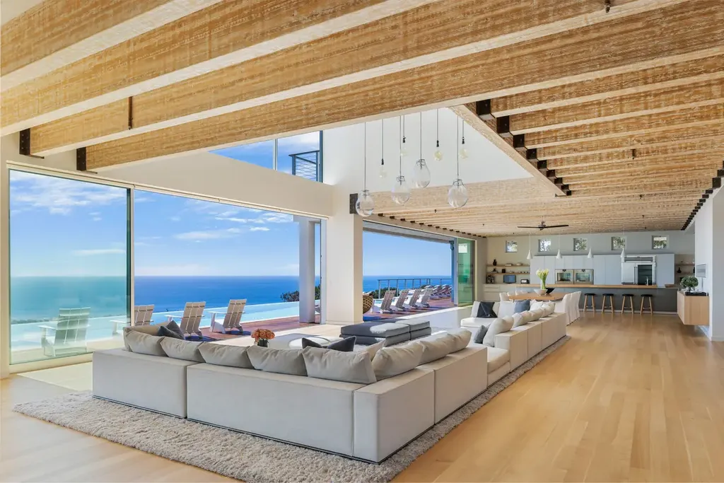 23800 Malibu Crest Drive Home in Malibu, California. Experience the pinnacle of coastal living in this new construction estate on a 3.4-acre promontory in Malibu. With breathtaking ocean, mountain, and canyon views, this 16,500-SF compound features a main house and guest house with luxurious amenities, including a Bulthaup chef's kitchen, infinity pool, and spa. 