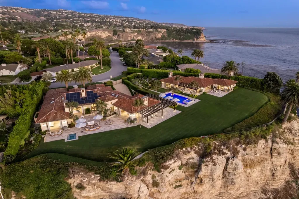 245 Rocky Point Road Home in Palos Verdes Estates, California. Nestled on the western-most point of Palos Verdes Estates, this expansive 1.15-acre compound offers unparalleled luxury and seclusion with 180-degree views of the California coastline. Designed by renowned interior designer Tim Clarke, this coastal masterpiece seamlessly blends stone and plaster with the natural surroundings.