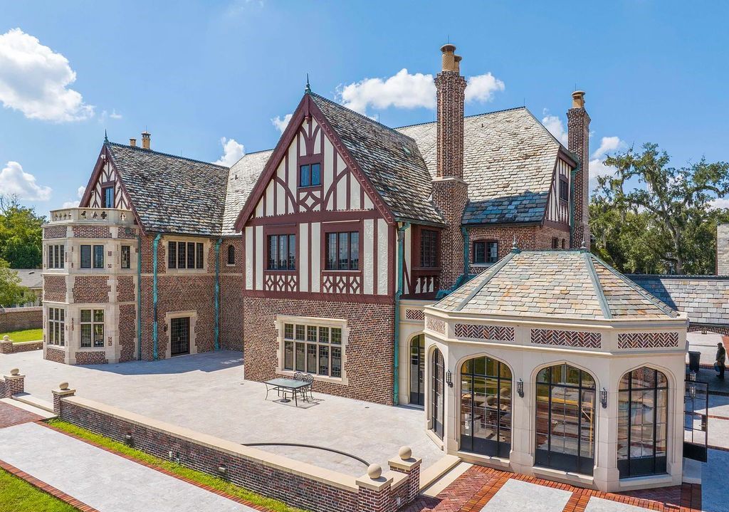 Experience the grandeur of the Roaring Twenties at 3730 Richmond St in Jacksonville, Florida. This Tudor Revival estate, listed on the National Historic Register and featured in six movies, has been meticulously renovated to showcase old-world craftsmanship and exquisite attention to detail.