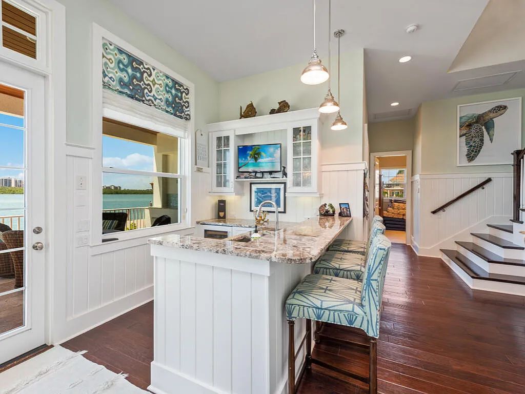 Nestled in prestigious Collier Bay on Marco Island, 960 Giralda Ct embodies coastal luxury living at its finest. With unobstructed bay views, this 2014-built, 4-bedroom, 5-bathroom home seamlessly combines opulence and coastal chic style.