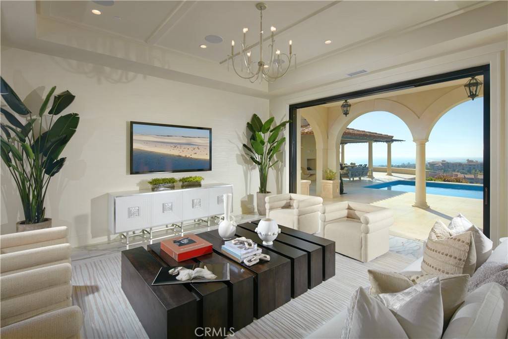 3 Del Mar Home in Newport Beach, California. Nestled behind double gates in the esteemed Estate Collection at Crystal Cove, this brand-new custom home (completed in 2023) graces one of Newport Coast's most coveted streets. Drawing inspiration from classic northern Italian villas, this grand residence offers breathtaking vistas of the Pacific Ocean, Pelican Hill Golf Course, Newport Harbor, verdant canyons, and stunning sunsets. 