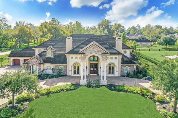 This Palatial Home in Weston Lakes Features Guesthouse, Pool Oasis, and a 20-Car Garage Offered at $2.3M