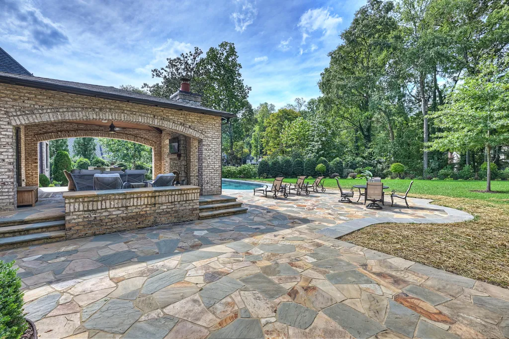 5201 Carmel Park Drive Home in Charlotte, North Carolina. Experience modern luxury living in the heart of South Charlotte with this exquisite chateau overlooking a 1.4-acre lot in Carmel Park. Built in 2016 by Kingswood Homes, this home offers a comfortable, open floorplan with abundant natural light and stunning views of nature.