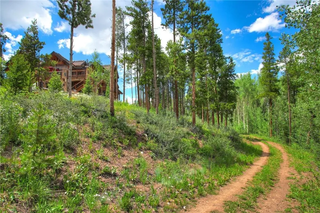 60 Iron Mask Road Home in Breckenridge, Colorado. Experience the pinnacle of mountain luxury living in this stunning Breckenridge property. Enjoy private gondola access, breathtaking ski slope views, expansive decks, and an array of in-house amenities, including a jacuzzi, sauna, and wine cellar. Whether you're seeking adventure or relaxation, this multi-family retreat offers the perfect escape in the heart of the Rockies.