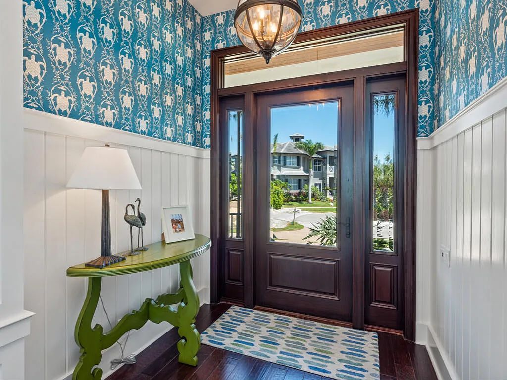 Nestled in prestigious Collier Bay on Marco Island, 960 Giralda Ct embodies coastal luxury living at its finest. With unobstructed bay views, this 2014-built, 4-bedroom, 5-bathroom home seamlessly combines opulence and coastal chic style.