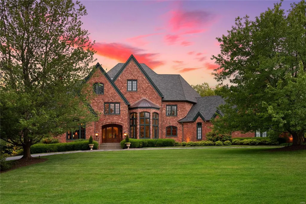 8 Lochinvar Drive Home in Saint Louis, Missouri. This stunning custom built home features a cascading waterfall, spacious living areas, and a finished lower level with every amenity. It is perfect for everyday living and entertaining.