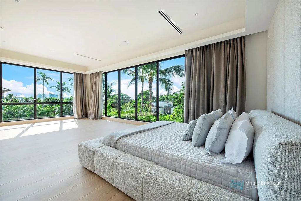 Welcome to the epitome of luxury living in this new 7-bedroom, 7-bathroom estate at 1200 NE 87th St, Miami, Florida, completed in 2023. Designed with the utmost sophistication, it offers spacious living areas, a connected guest house, and top-notch amenities.
