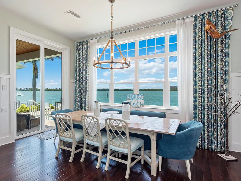 Nestled in prestigious Collier Bay on Marco Island, 960 Giralda Ct embodies coastal luxury living at its finest. With unobstructed bay views, this 2014-built, 4-bedroom, 5-bathroom home seamlessly combines opulence and coastal chic style.