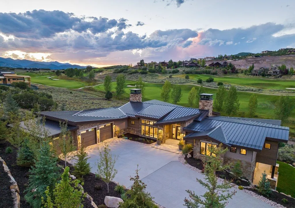 9406 N Uinta Drive Home in Kamas, Utah. Discover the epitome of luxury living in this 5-bedroom, 7-bathroom turn-key estate overlooking the 18th fairway of the Mark O'Meara signature golf course at Tuhaye. This inviting home leaves no detail overlooked, featuring heated floors on both levels, a world-class in-home theater, a golf simulator, and a gaming room.