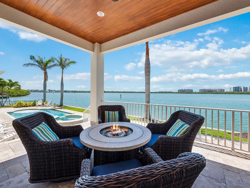 Nestled in prestigious Collier Bay on Marco Island, 960 Giralda Ct embodies coastal luxury living at its finest. With unobstructed bay views, this 2014-built, 4-bedroom, 5-bathroom home seamlessly combines opulence and coastal chic style.