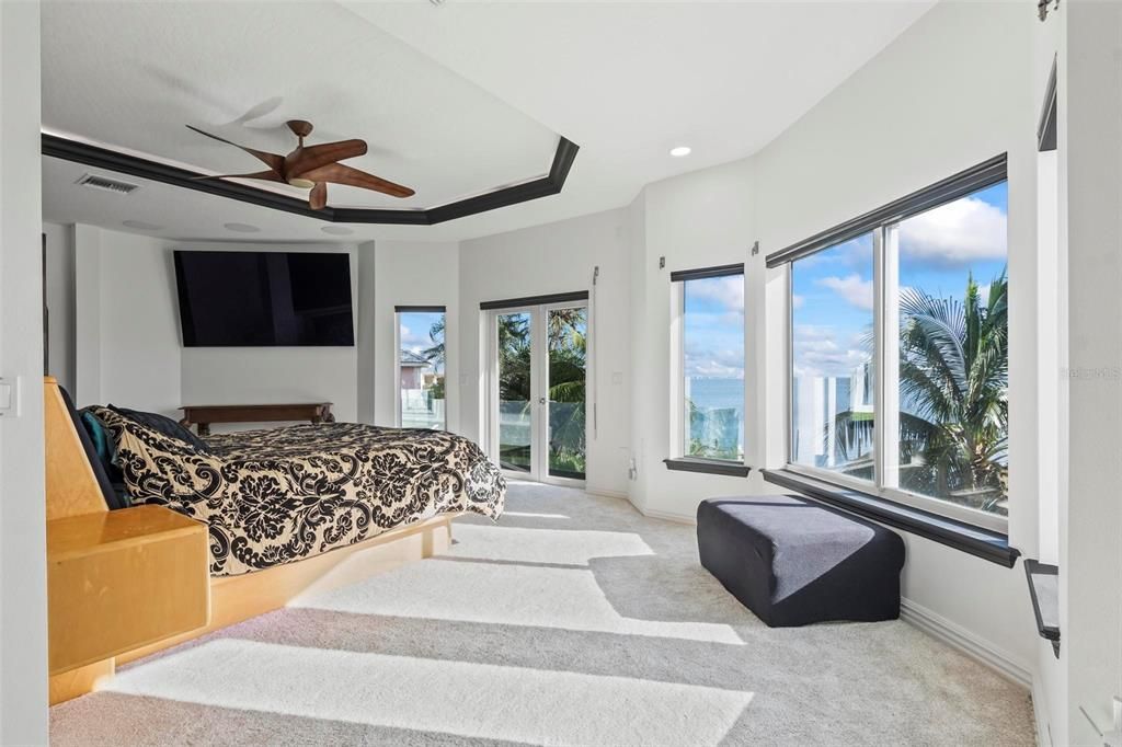 Discover the epitome of luxury living at 2 River Falls Drive, Cocoa Beach, Florida. This 5-bedroom, 6-bathroom custom estate, fully remodeled in 2022, offers 150 feet of pristine river frontage and unobstructed views.