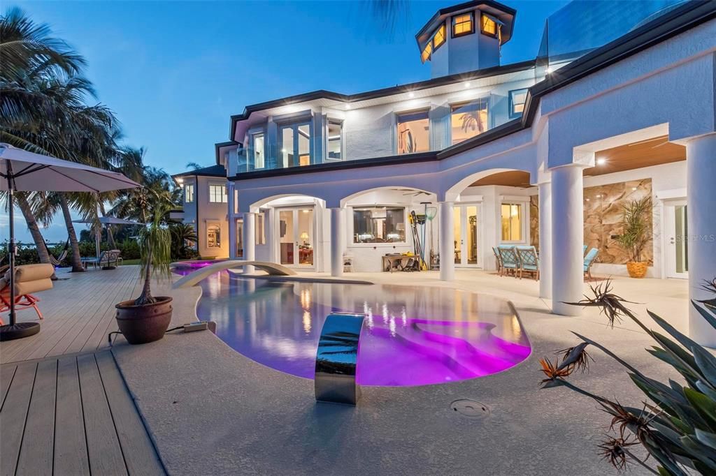 Discover the epitome of luxury living at 2 River Falls Drive, Cocoa Beach, Florida. This 5-bedroom, 6-bathroom custom estate, fully remodeled in 2022, offers 150 feet of pristine river frontage and unobstructed views.