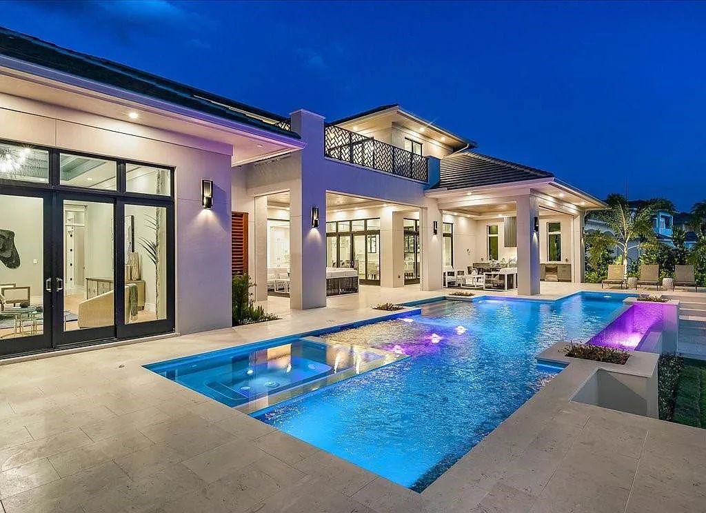 Experience waterfront luxury like never before at 3841 Crayton Road in Naples, Florida. This 5-bedroom, 6-bathroom masterpiece, built in 2023, is the result of a remarkable collaboration between Knauf Koenig, Falconer Jones, and Clive Daniel interior designers.