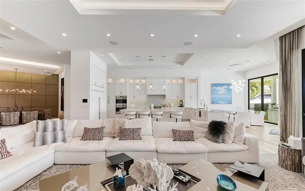 Discover the epitome of luxury in this contemporary Lighthouse Point home with 6 bedrooms, 7 bathrooms, and 6,318 square feet of living space, built in 2019. Perfectly designed for yachtsmen, it offers 243 feet of deep water access just minutes from Hillsboro Inlet.