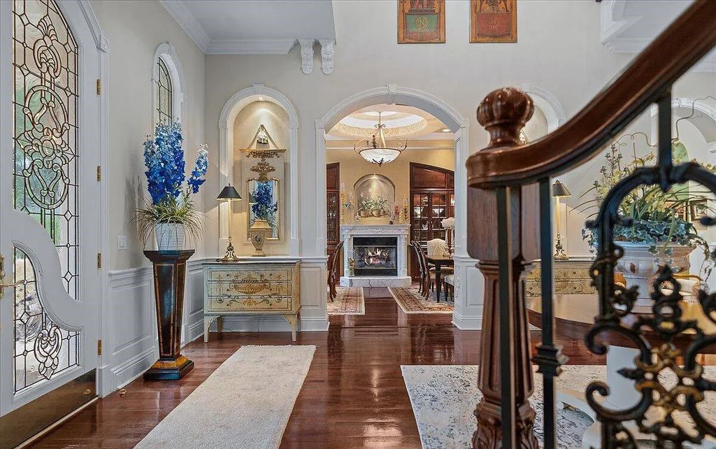 Nestled on Indialantic's prestigious Riverside Drive, this 5-bedroom, 7-bathroom estate offers an unparalleled blend of grandeur and serenity. As you pass through private wrought iron gates, a tropical paradise reminiscent of a centuries-old French Chateau unfolds.