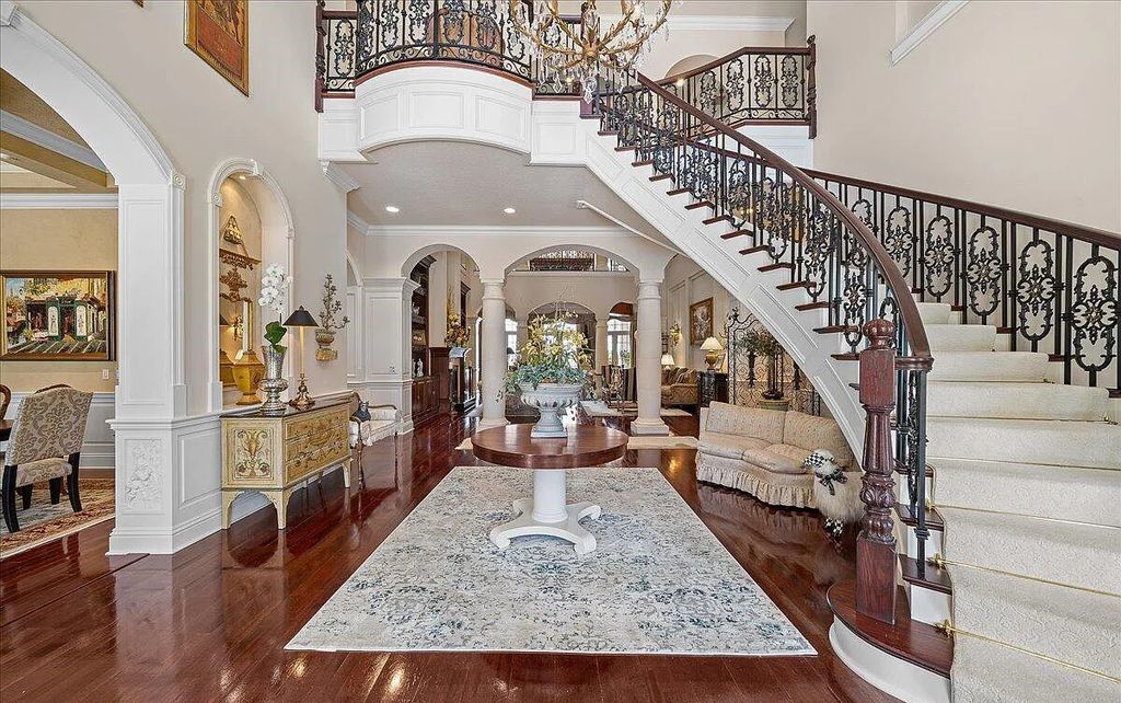 Nestled on Indialantic's prestigious Riverside Drive, this 5-bedroom, 7-bathroom estate offers an unparalleled blend of grandeur and serenity. As you pass through private wrought iron gates, a tropical paradise reminiscent of a centuries-old French Chateau unfolds.