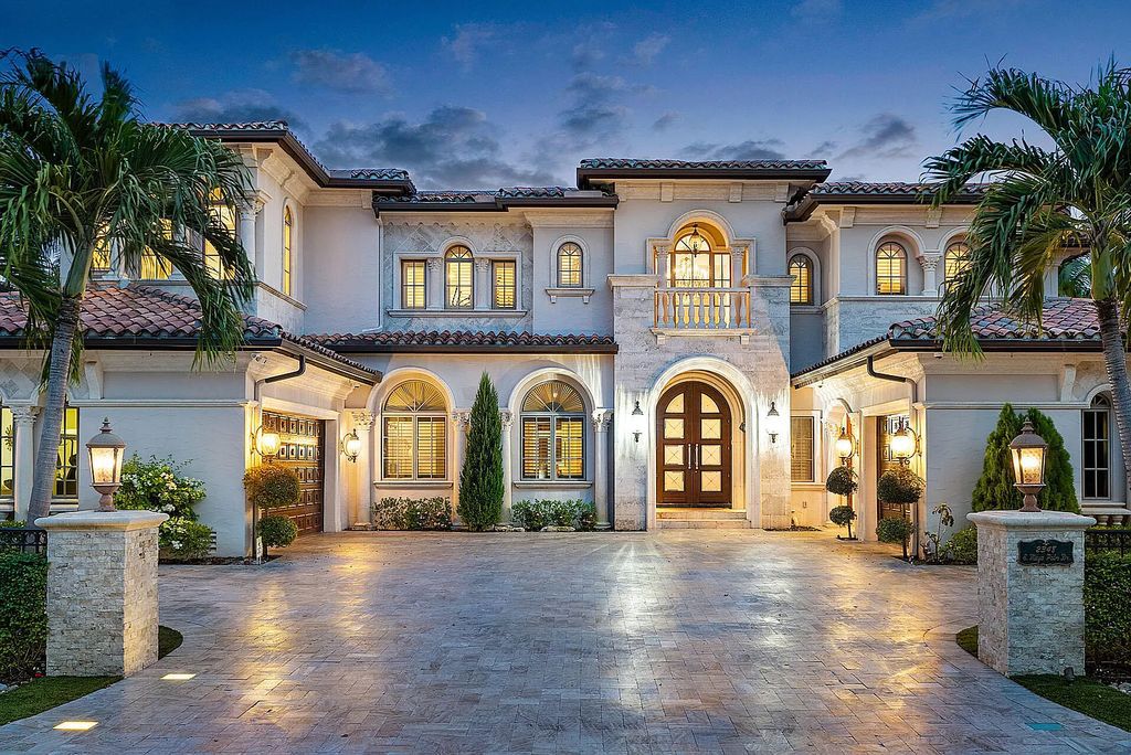 Nestled within Boca Raton's prestigious Royal Palm Yacht & Country Club, 2348 E Maya Palm Dr offers an unparalleled waterfront lifestyle. This 6-bedroom, 9-bathroom estate boasts over 8,000 square feet of luxurious living space, including a gourmet open-air kitchen, a 7-seat home theater, a distinguished study, and an elevator.