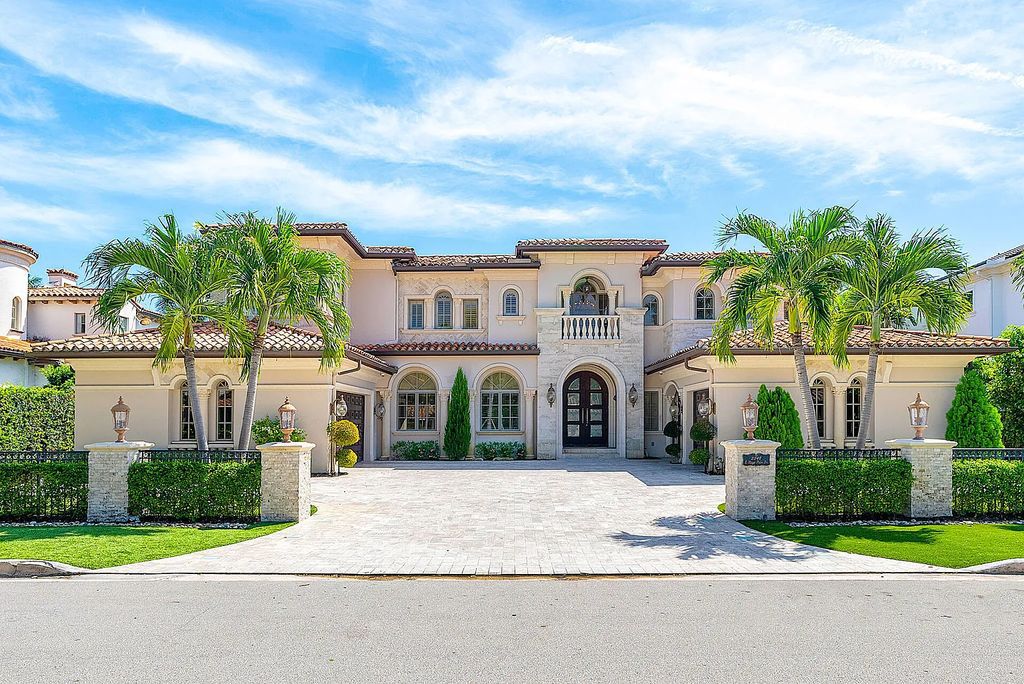 Nestled within Boca Raton's prestigious Royal Palm Yacht & Country Club, 2348 E Maya Palm Dr offers an unparalleled waterfront lifestyle. This 6-bedroom, 9-bathroom estate boasts over 8,000 square feet of luxurious living space, including a gourmet open-air kitchen, a 7-seat home theater, a distinguished study, and an elevator.