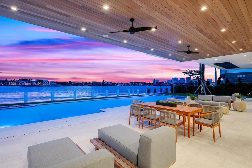 Luxury awaits in this 2021-built, 6-bed, 9-bath modern masterpiece in Fort Lauderdale's Harbor Beach gated community. Designed by Randall Stofft and crafted by Sarkela Corp, this 9,451 sq ft home features 120 ft of Intracoastal frontage, a lap pool, and outdoor kitchen.