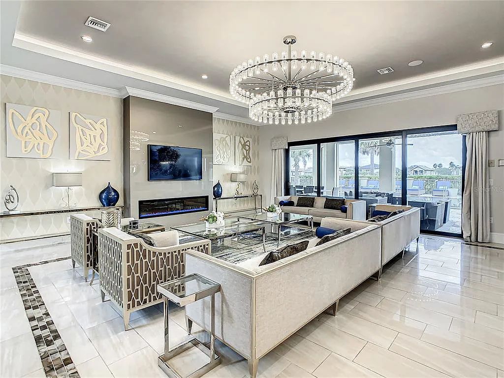 Discover 1121 Grand Traverse Pkwy, Kissimmee, Florida - an exquisite 9-bedroom, 12-bathroom estate nestled in the prestigious Estates neighborhood of Reunion Resort & Club. This 2018-built, 10,541-square-foot mansion is a high-performing short-term rental property, featuring a modern, elegant design with high-end fixtures and a state-of-the-art games room.