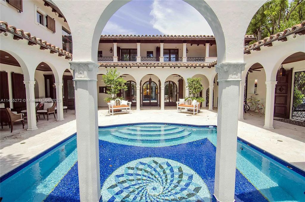 Escape to the lap of luxury in Miami Beach's Montecito neighborhood with this fully renovated 5-bed, 6-bath masterpiece boasting breathtaking downtown views. The 6,977-square-foot interior features vaulted ceilings, a gourmet kitchen, and en-suite bedrooms with walk-in closets.