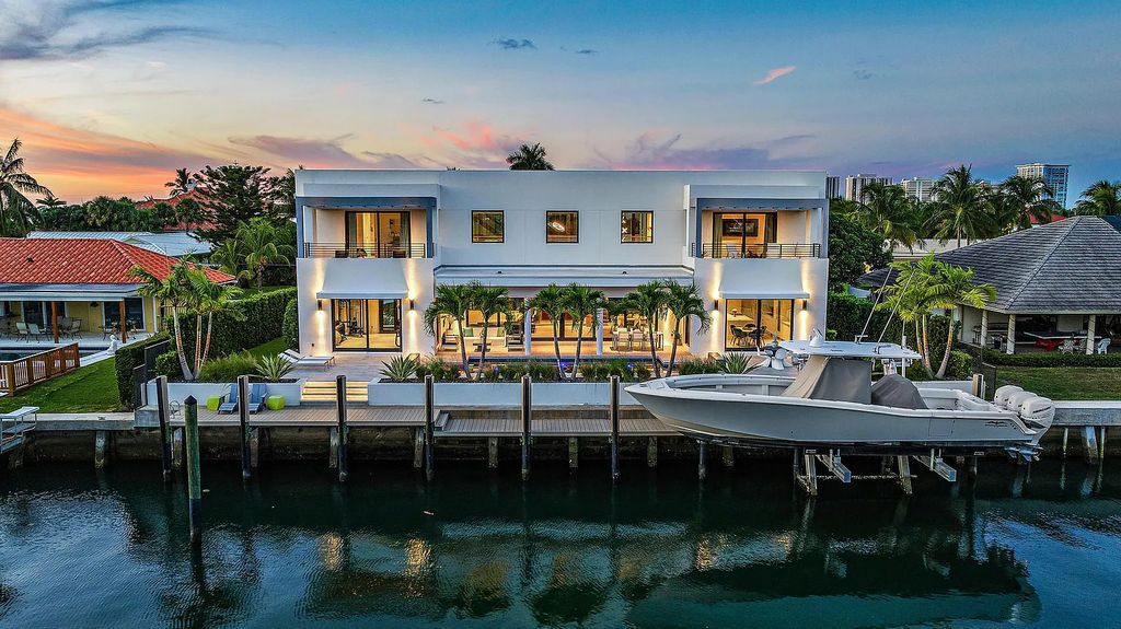 Nestled in the prestigious Riviera Beach, Florida, 1091 Gulfstream Way offers a cutting-edge waterfront lifestyle. This modern masterpiece boasts 5 bedrooms, 2 offices, a spacious gym, and a media room, providing ample space for work and leisure. Its gourmet kitchen with Liebherr appliances and a saltwater pool adds to the luxurious living.
