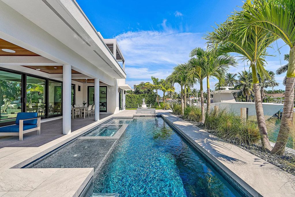 Nestled in the prestigious Riviera Beach, Florida, 1091 Gulfstream Way offers a cutting-edge waterfront lifestyle. This modern masterpiece boasts 5 bedrooms, 2 offices, a spacious gym, and a media room, providing ample space for work and leisure. Its gourmet kitchen with Liebherr appliances and a saltwater pool adds to the luxurious living.