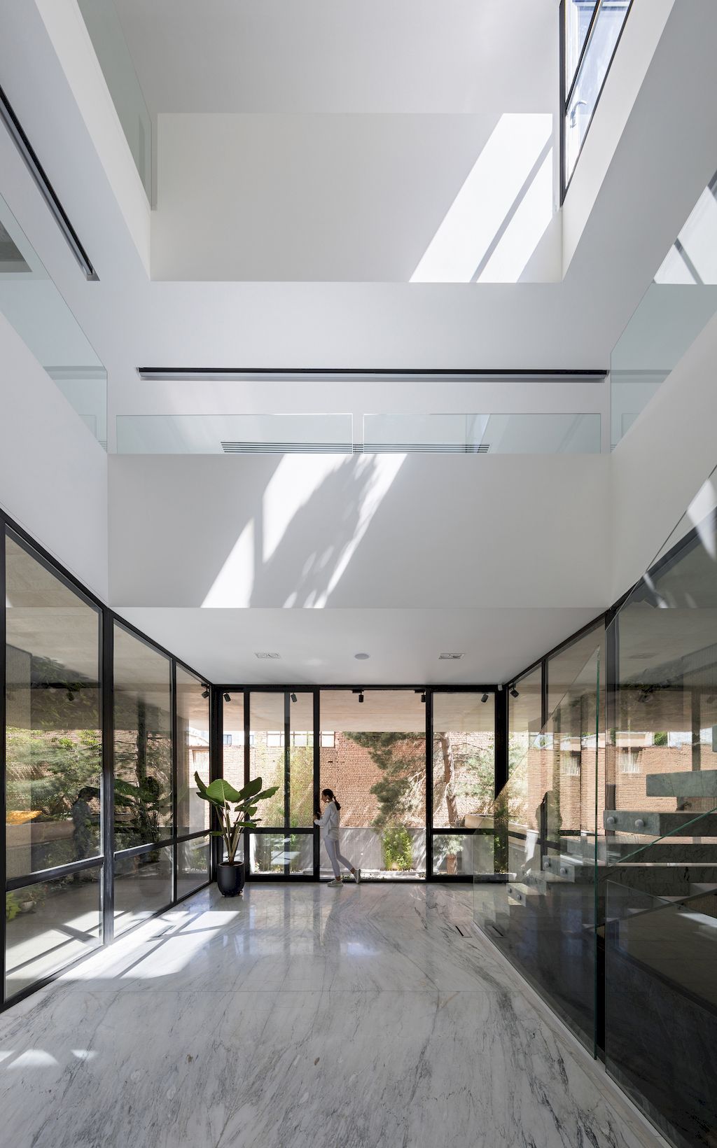 Outside-in House with Harmonious Space Connection by MA Office