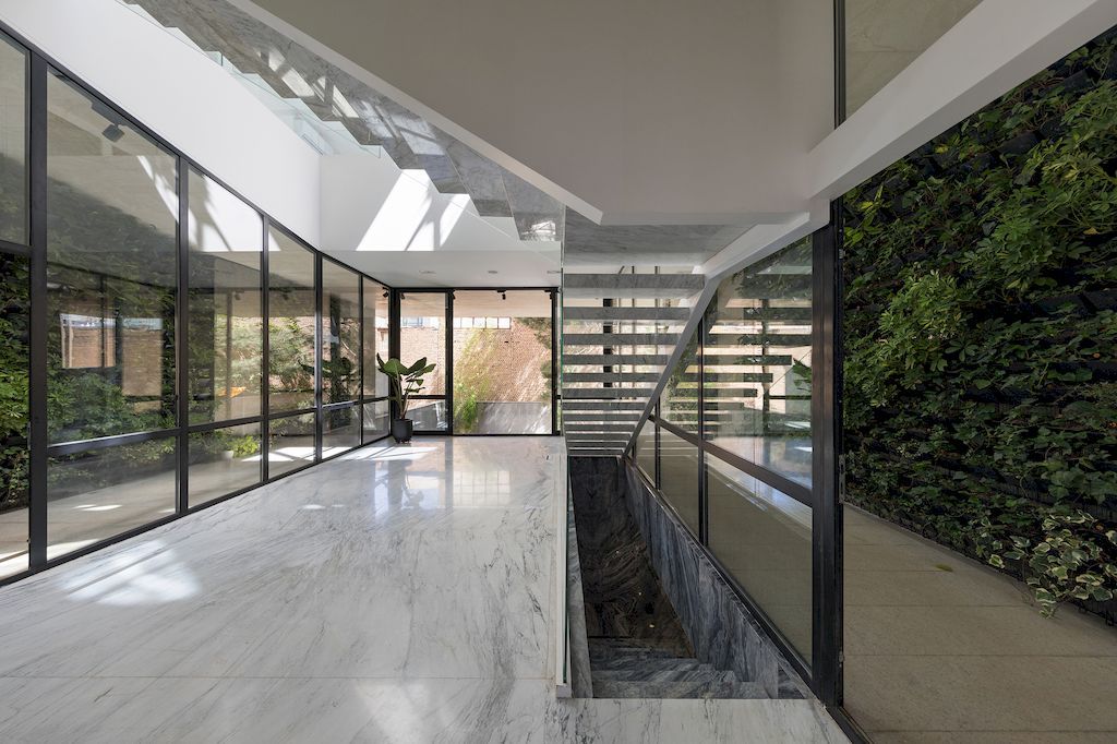 Outside-in House with Harmonious Space Connection by MA Office