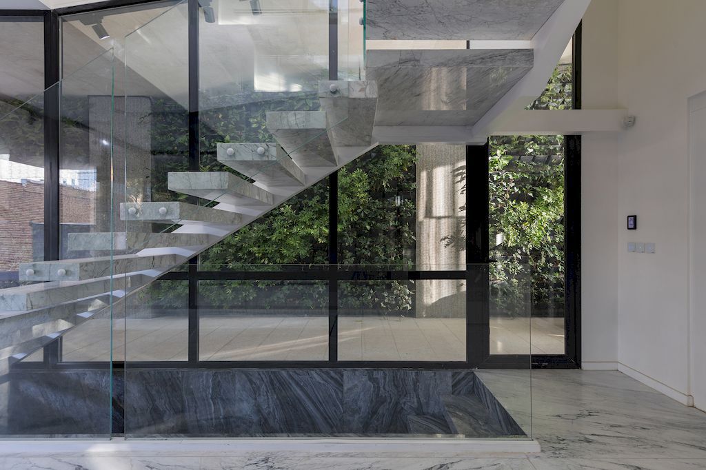 Outside-in House with Harmonious Space Connection by MA Office