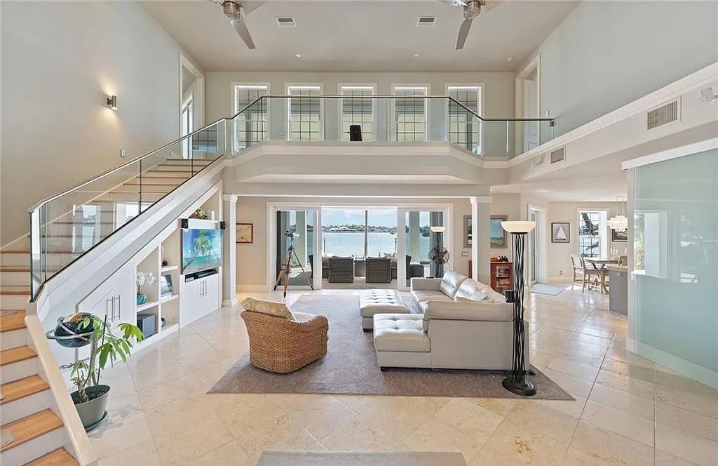 Nestled in Marco Island's prestigious Estate section, 581 Conover Ct is a waterfront gem offering 247' of direct access frontage on Roberts Bay with 11' elevation. This 2000-built Slocum & Christian home boasts an open - living concept, three bedrooms, three baths, and breathtaking water views from every room.