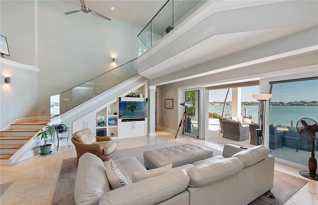 Nestled in Marco Island's prestigious Estate section, 581 Conover Ct is a waterfront gem offering 247' of direct access frontage on Roberts Bay with 11' elevation. This 2000-built Slocum & Christian home boasts an open - living concept, three bedrooms, three baths, and breathtaking water views from every room.