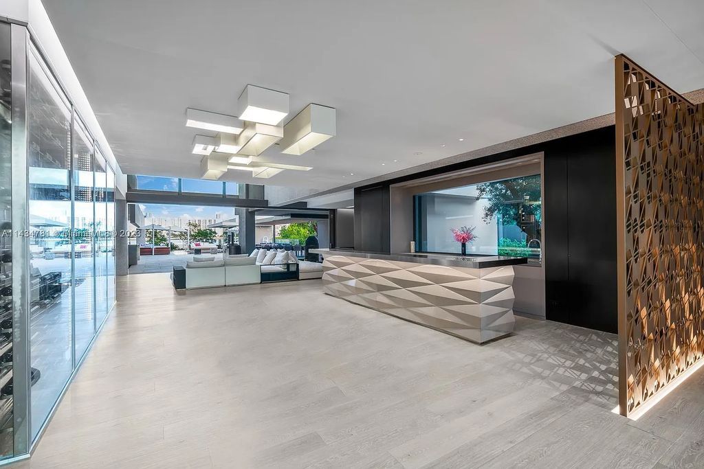Nestled on the exclusive Star Island in Miami Beach, this 2019-built estate at 27 Star Island Drive is the epitome of luxury living. With 9 bedrooms and 12 bathrooms, the meticulously crafted interiors span nearly 23,000 square feet, showcasing a breathtaking 21-foot-high ceiling salon, a chef's dream kitchen, and multiple entertainment spaces, including two media rooms.
