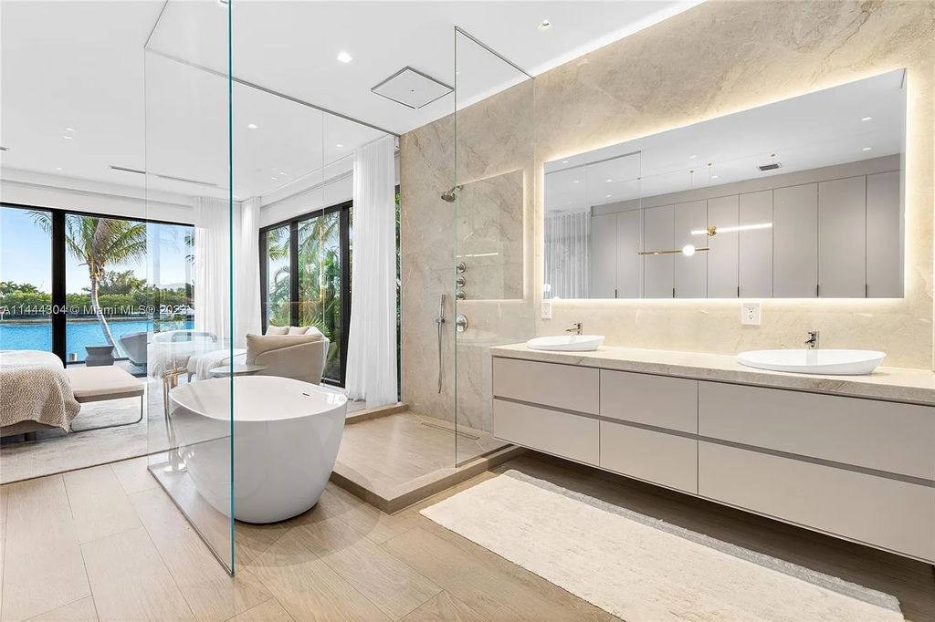 Experience the epitome of Miami Beach luxury living at 250 S Hibiscus Drive. This immaculate 4-bed, 4-bath waterfront home boasts a modern open-concept layout, bathed in natural light and adorned with high-end fixtures.