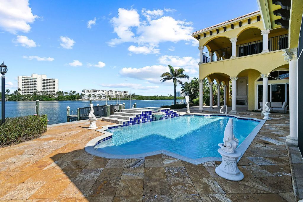 Discover unparalleled waterfront living at 19709 Harbor Road, Jupiter, Florida. This exquisite 3-bedroom, 4-bathroom estate, spanning 5,319 square feet on a 0.37-acre lot, presents breathtaking Intracoastal Waterway views.