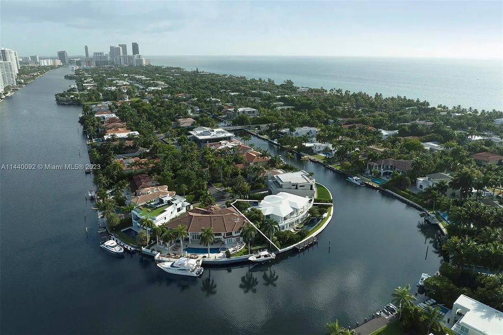 142 S Island Drive, a contemporary waterfront estate in Golden Beach, Florida, offers luxury living at its finest. Situated on a 0.41-acre lot with a private dock, this 6-bedroom, 9-bathroom residence built in 2011 spans 7,752 square feet and boasts sweeping Intracoastal vistas.