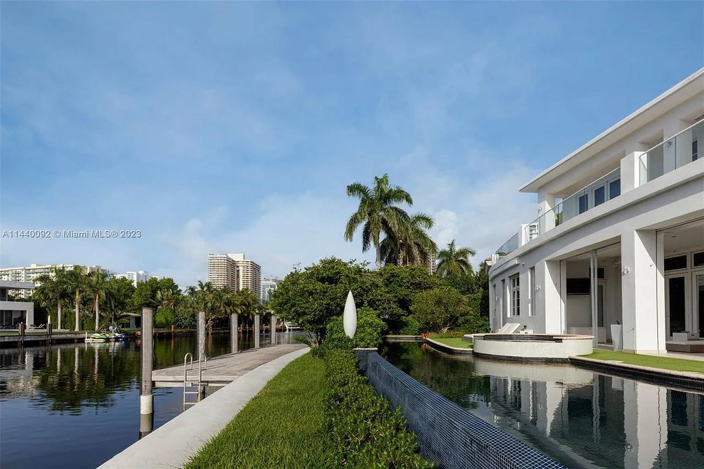 142 S Island Drive, a contemporary waterfront estate in Golden Beach, Florida, offers luxury living at its finest. Situated on a 0.41-acre lot with a private dock, this 6-bedroom, 9-bathroom residence built in 2011 spans 7,752 square feet and boasts sweeping Intracoastal vistas.