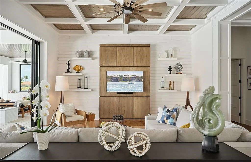 Experience the epitome of waterfront luxury at 541 Hammock Ct, Marco Island, Florida. Built in 2020 in the prestigious Coastal Contemporary Estates area, this home boasts grandeur with a 30-foot foyer ceiling and breathtaking water views.