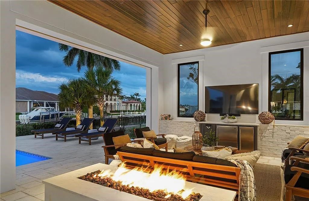 Experience the epitome of waterfront luxury at 541 Hammock Ct, Marco Island, Florida. Built in 2020 in the prestigious Coastal Contemporary Estates area, this home boasts grandeur with a 30-foot foyer ceiling and breathtaking water views.