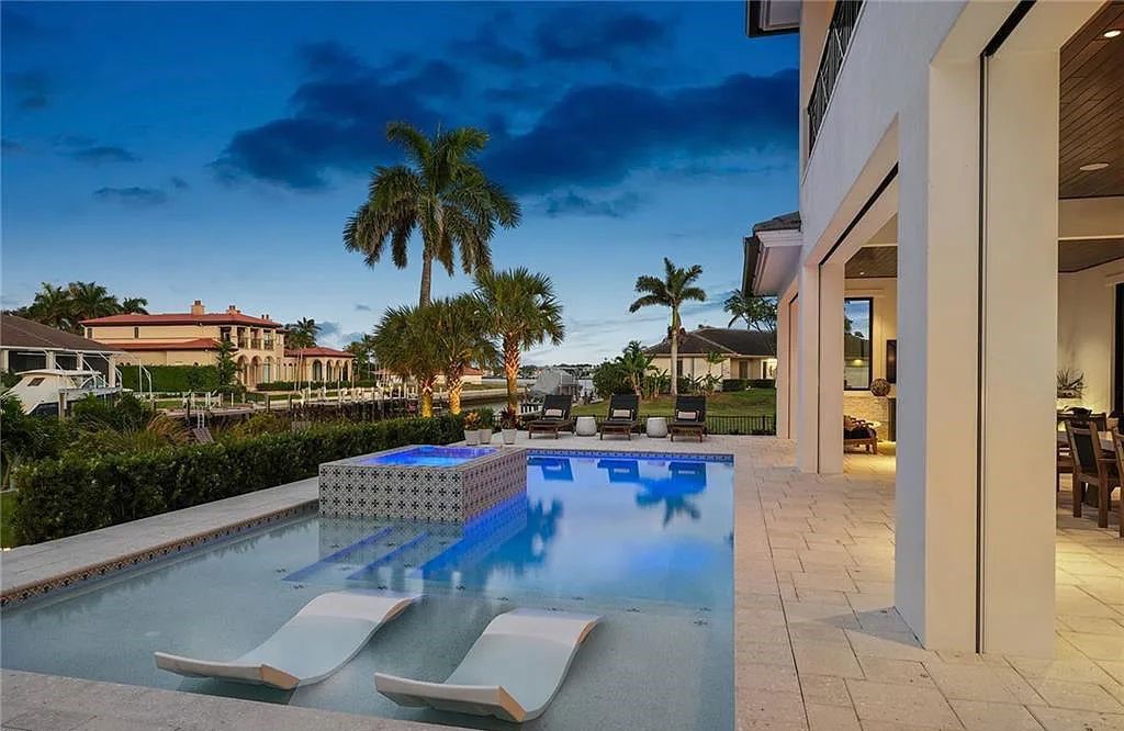 Experience the epitome of waterfront luxury at 541 Hammock Ct, Marco Island, Florida. Built in 2020 in the prestigious Coastal Contemporary Estates area, this home boasts grandeur with a 30-foot foyer ceiling and breathtaking water views.